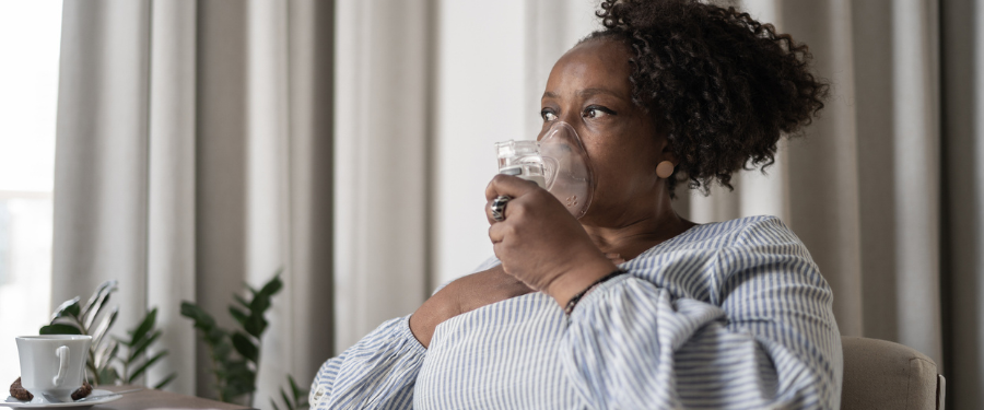 woman with asthma using nebulizer