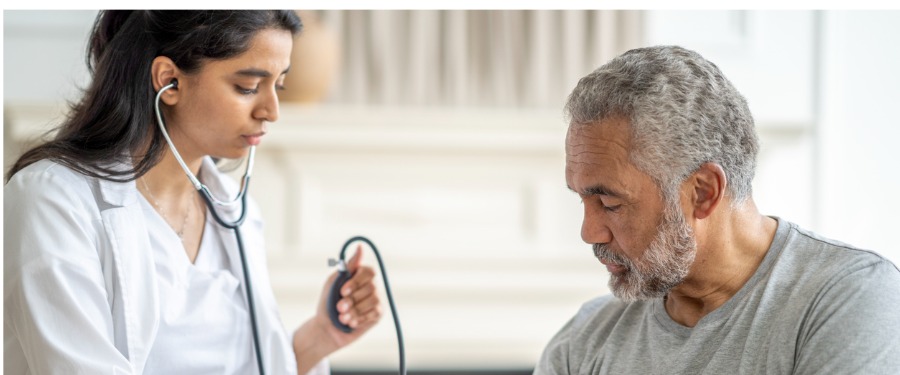 Resistant hypertension patient receiving blood pressure check