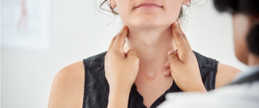 Woman getting throat examined to check for eosinophilic esophagitis