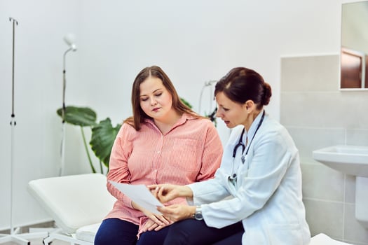 woman and doctor discussing obesity clinical trials