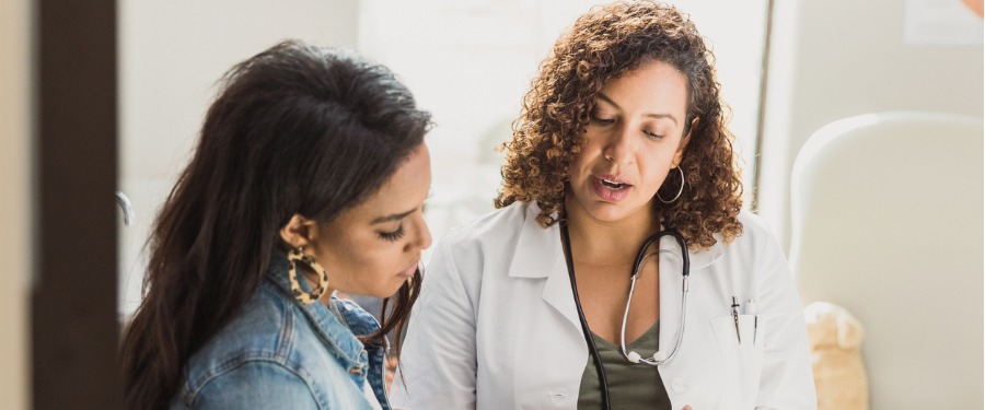 Woman discussing chronic kidney disease clinical trials with doctor