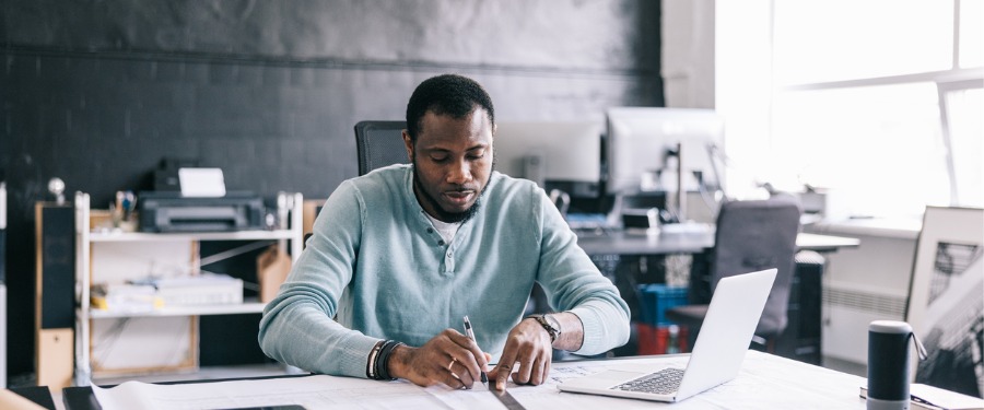 Man working on clinical trial patient recruitment proposal