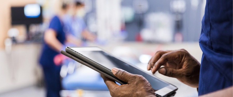 Site staff managing clinical trial enrollment on an iPad