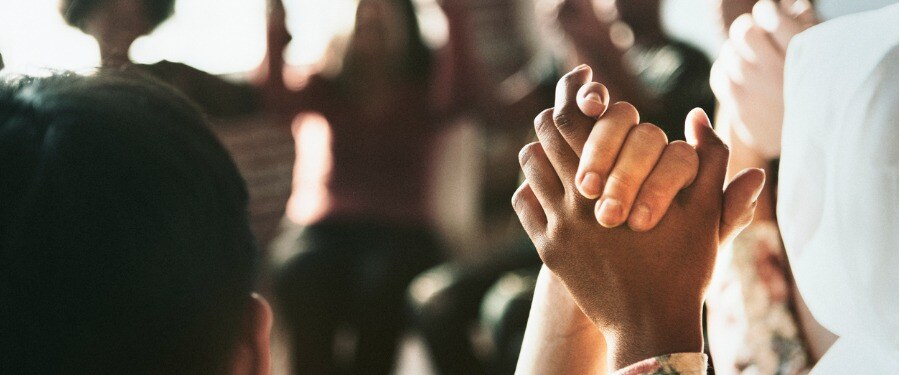 diverse people holding hands